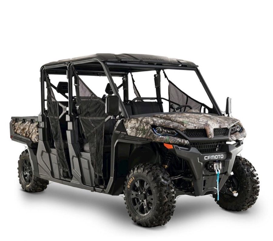Camouflage six-passenger UTV with a roof.
